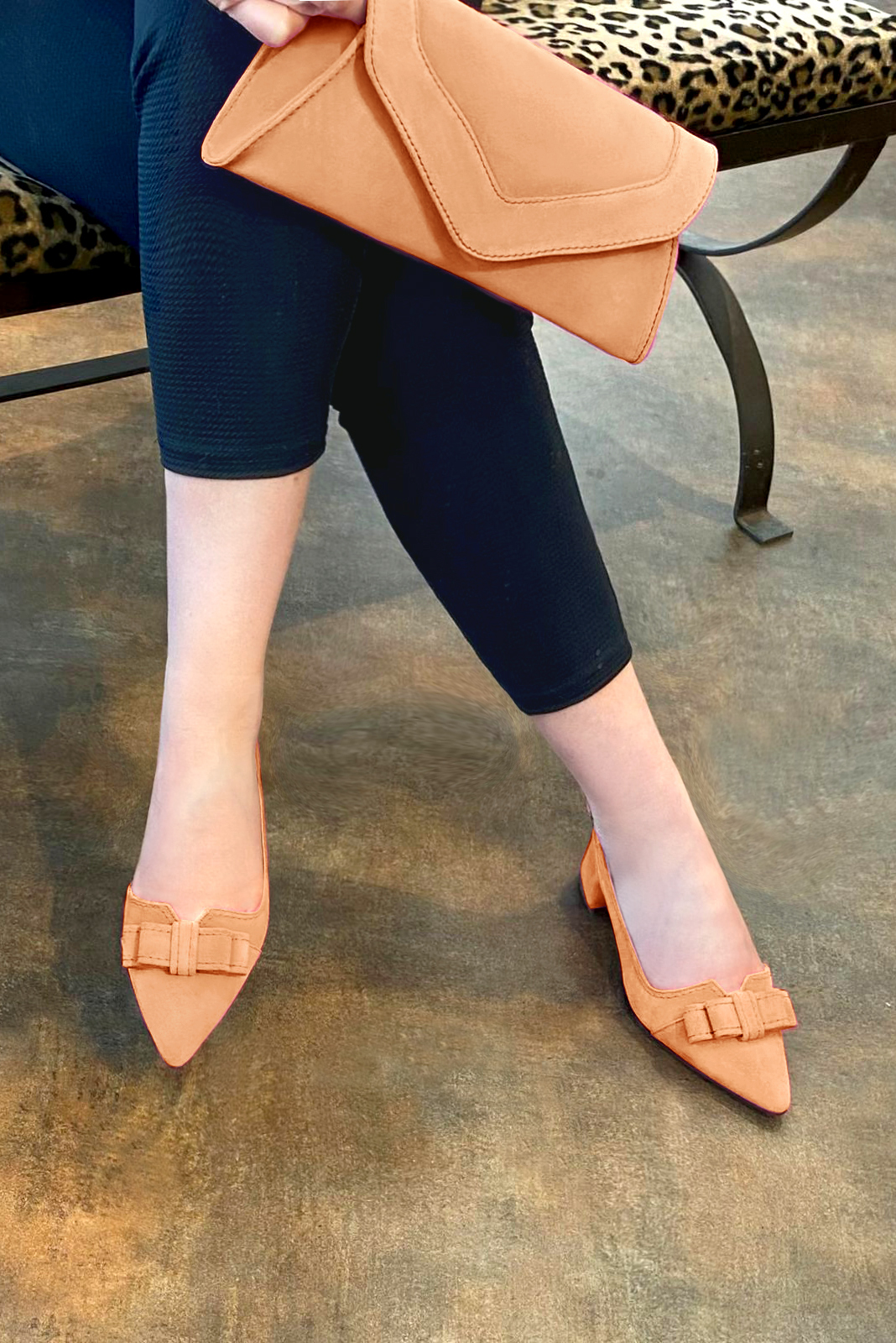 Marigold orange women's open back shoes, with a knot. Tapered toe. Low flare heels. Worn view - Florence KOOIJMAN